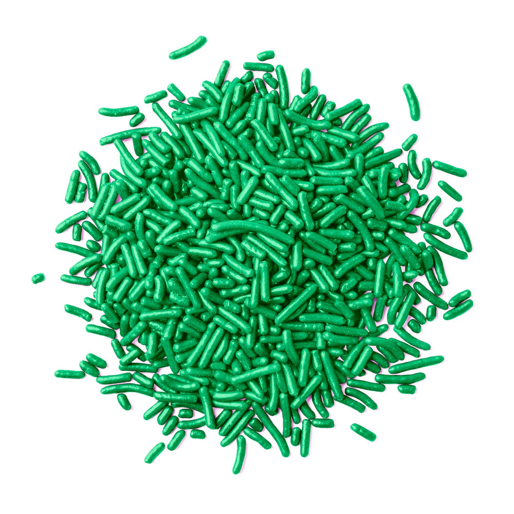 Birch & Meadow Green Sprinkles on a cake for festive decorating.