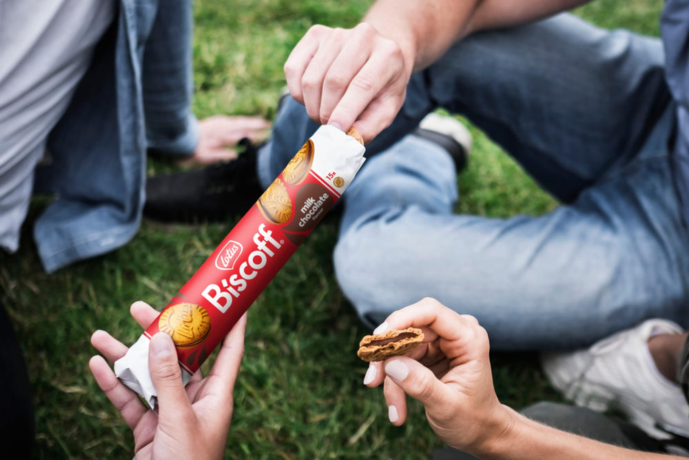 Biscoff milk chocolate sandwich cookies with tea or coffee companion