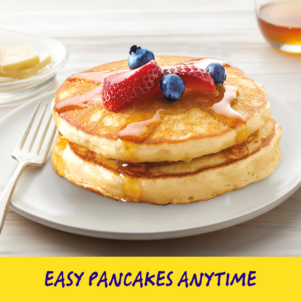 Bisquick Original Waffles cooking on a griddle for crisp edges