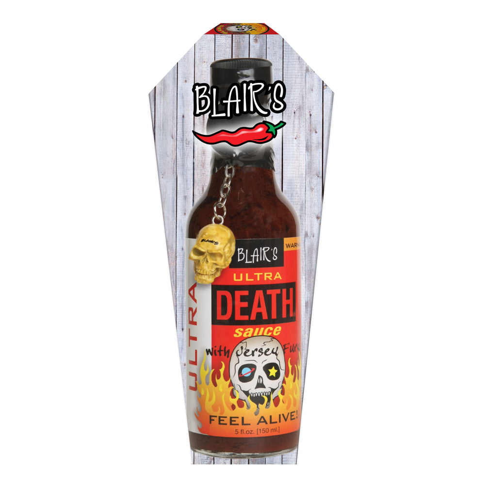 Blair's Ultra Death Sauce being poured reveals thick, fiery texture.