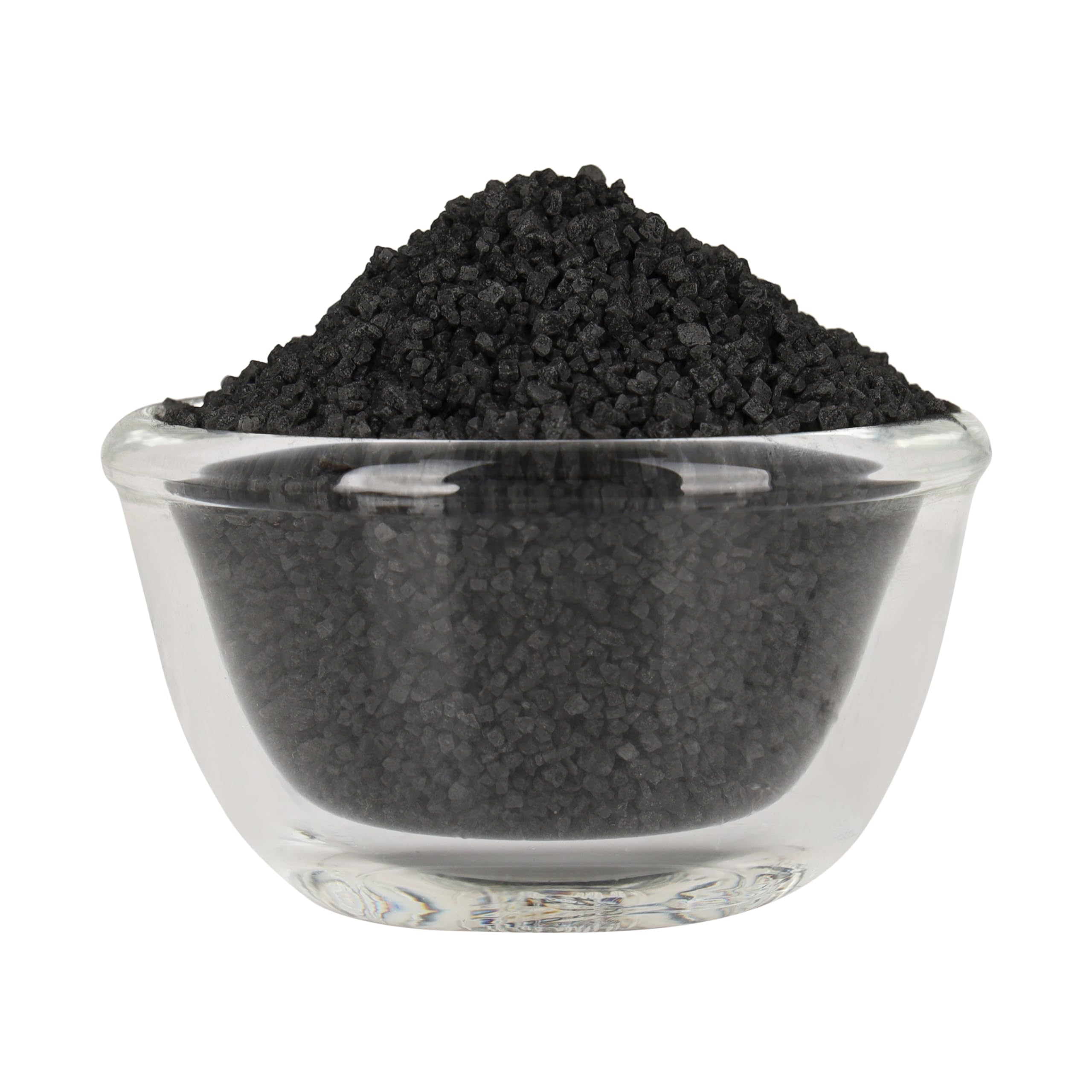 Bless International Black Salt crystal close-up in a spoon for purification rituals