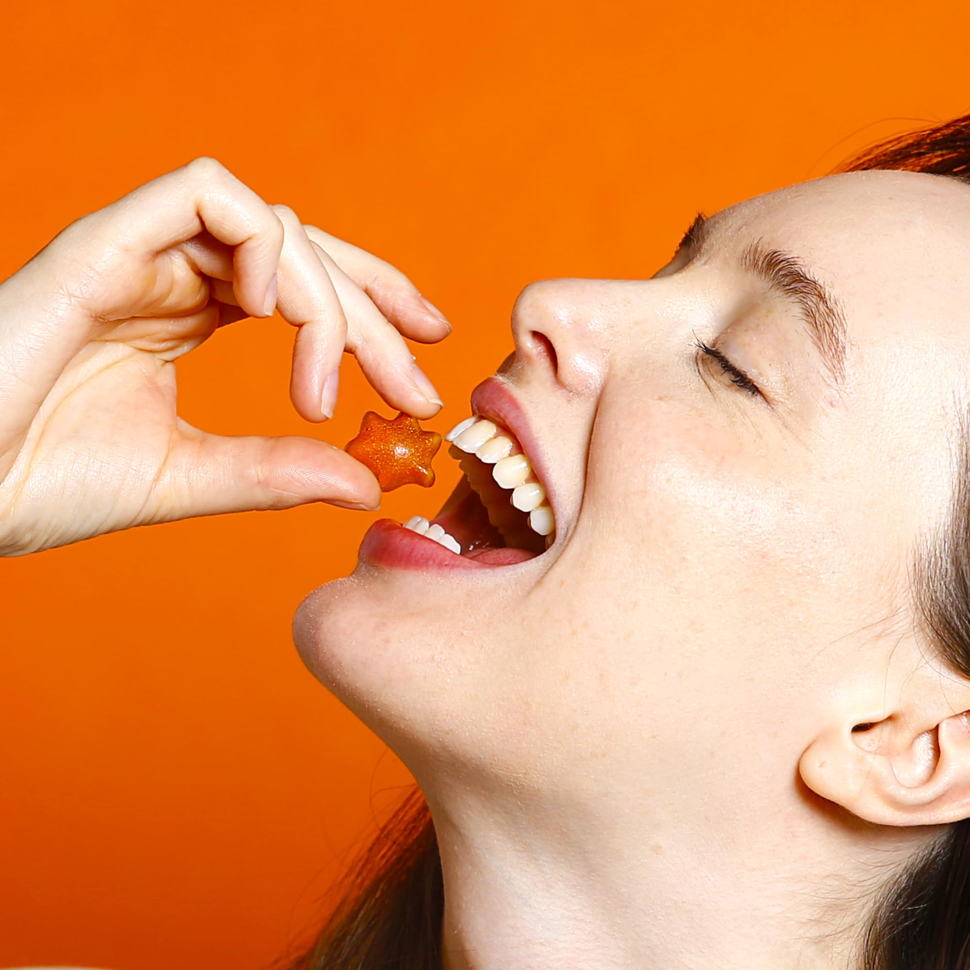 Blobs orange-peach gummies close-up, bright taste with no artificial dyes.