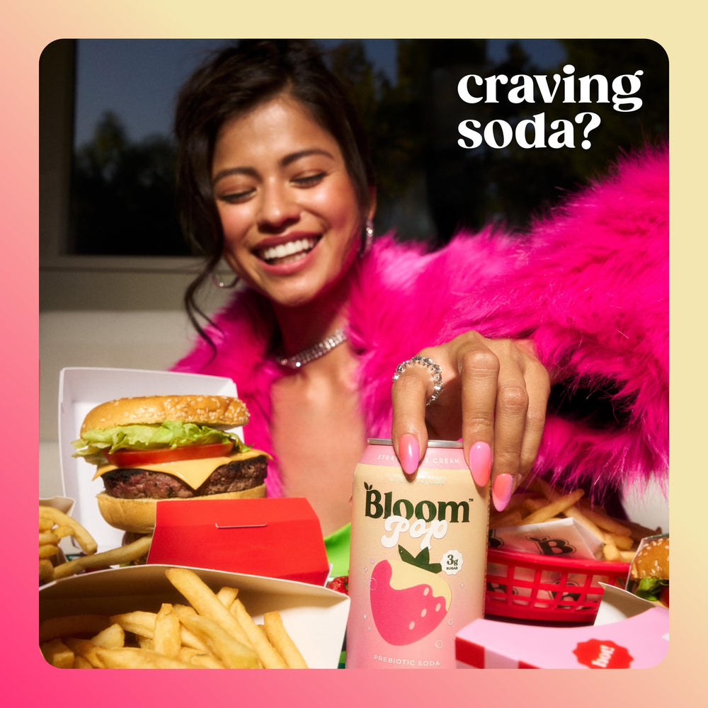 Chilled Bloom Pop Strawberry Cream can beside fresh strawberries signals refreshing, low-calorie flavor.