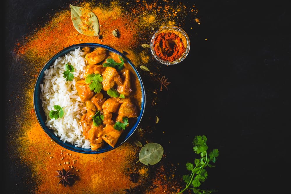 Blue Mountain Country Jamaican Curry Powder Hot seafood dish simmering with bold spice.
