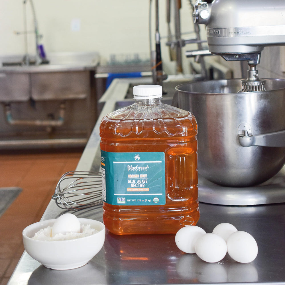 BLUE GREEN ORGANICS LIGHT agave syrup measured into batter for baking versatility.