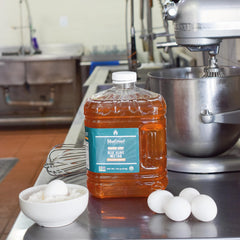 BLUE GREEN ORGANICS LIGHT agave syrup measured into batter for baking versatility.