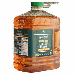 BLUE GREEN ORGANICS LIGHT agave syrup being poured into hot tea for gentle sweetness.