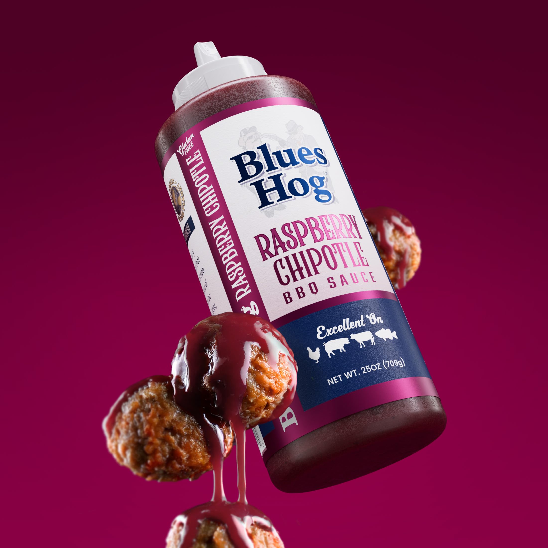 Blues Hog Raspberry Chipotle BBQ sauce serving suggestion at backyard barbecue.