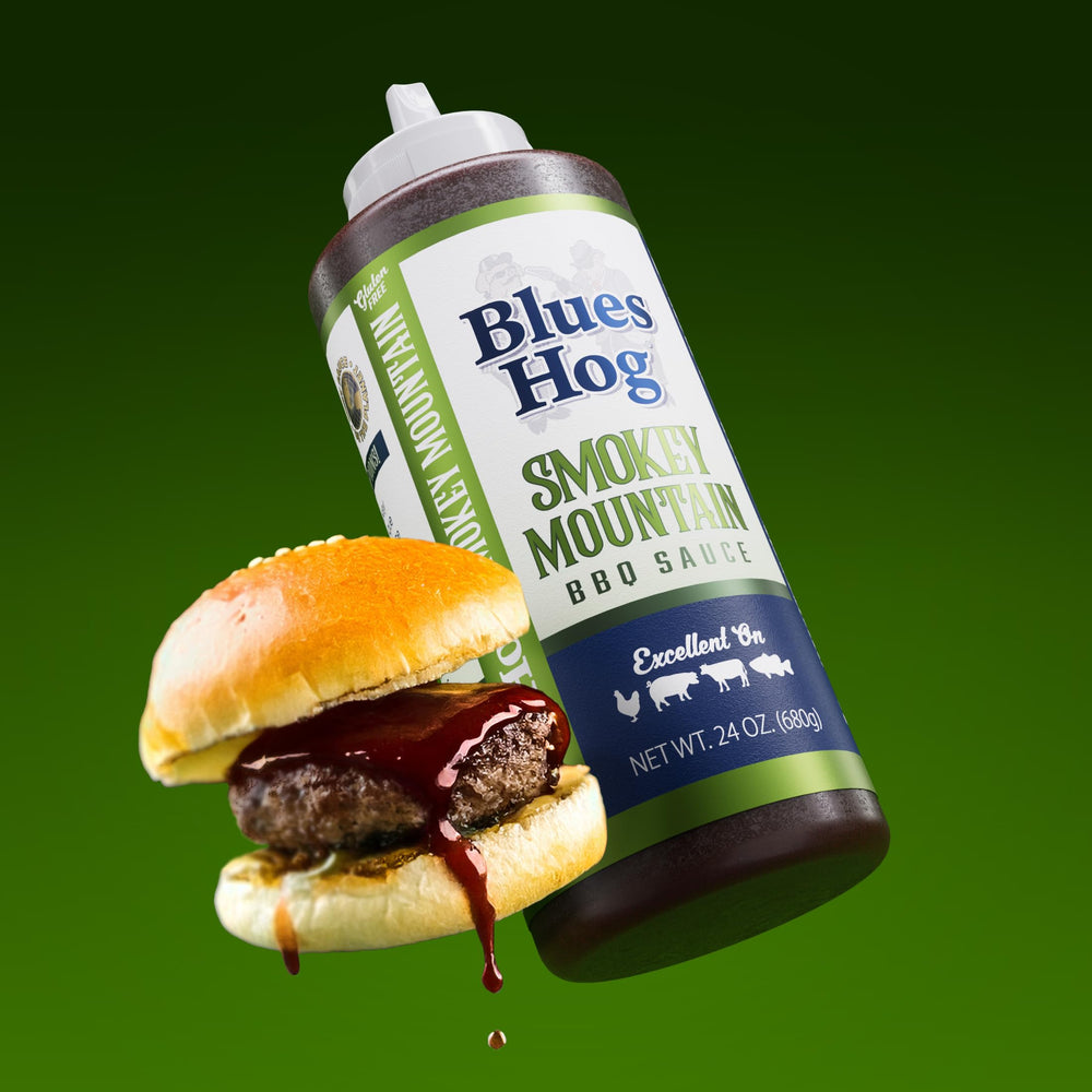 Blues Hog Smokey Mountain BBQ Sauce dipping with wings or vegetables.