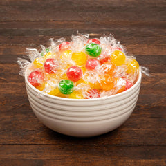 Blunon Sour Balls individually wrapped candies, travel-friendly for on-the-go snacking.