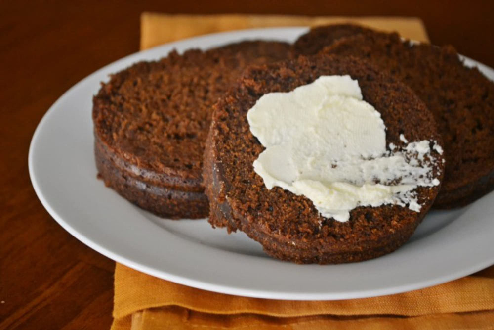 B&M Brown Bread Original slice on a plate, ideal for open-faced lunches.