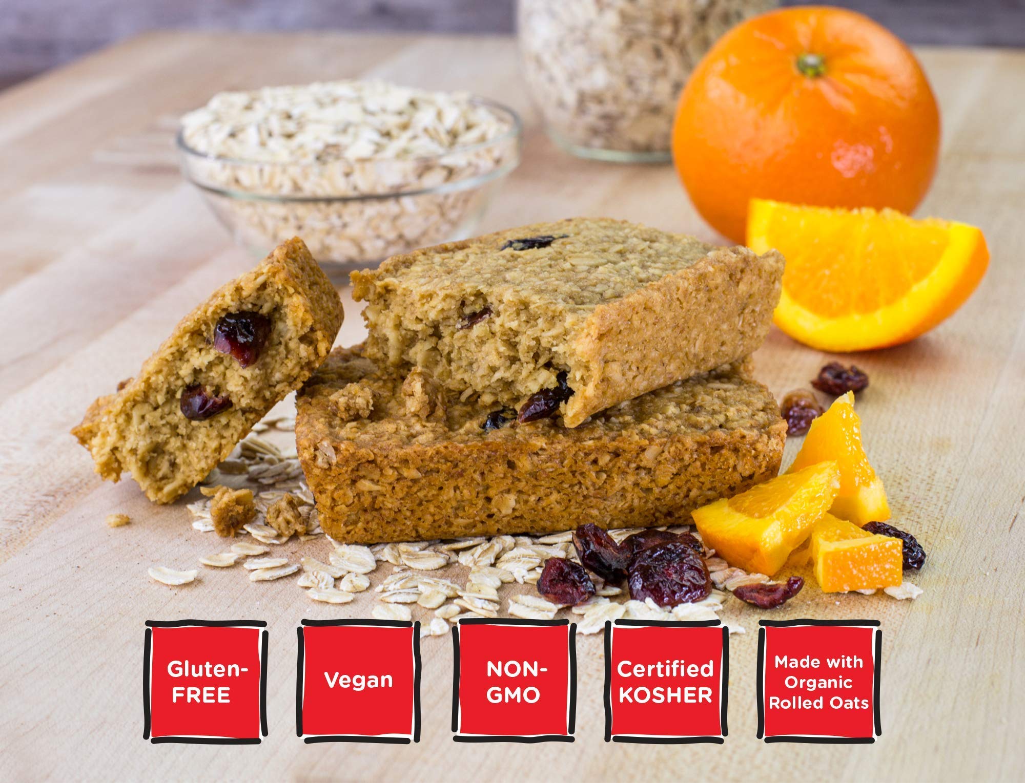 Ingredient close-up highlighting oats, cranberries, and orange zest for wholesome snacking.