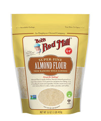 Measuring cups ready with Bob's Red Mill almond flour for gluten-free baking.