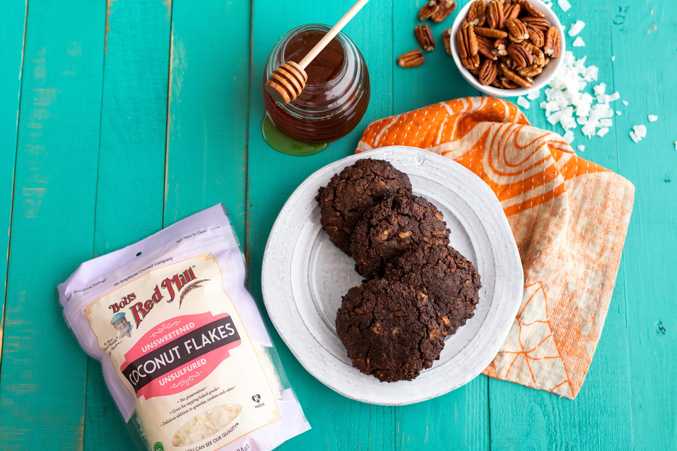 Bob's Red Mill coconut flakes packaging highlights Fair Trade and non-GMO.