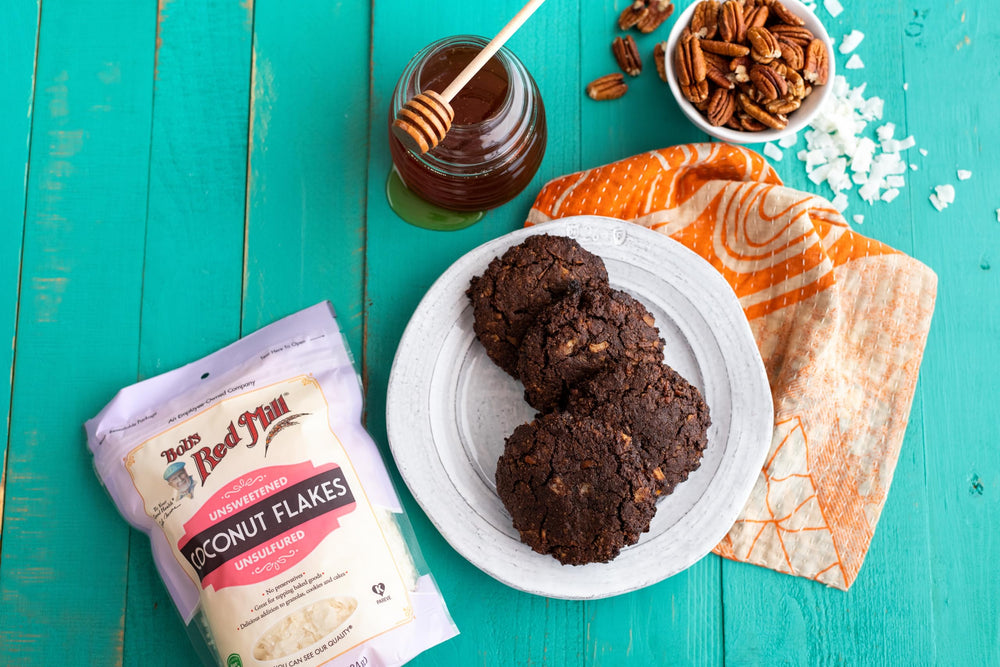 Bob's Red Mill coconut flakes packaging highlights Fair Trade and non-GMO.