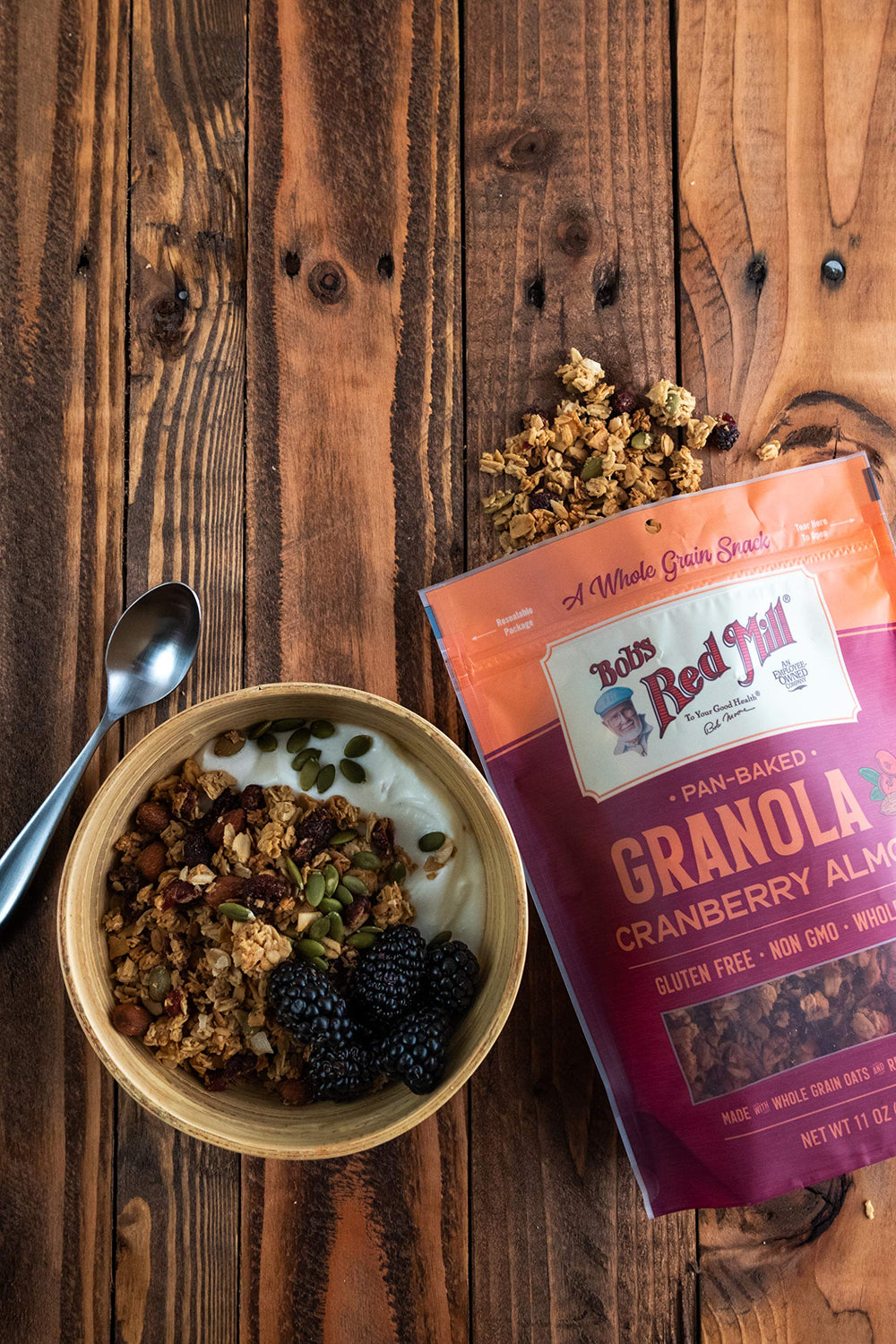 Bob's Red Mill Cranberry Almond Granola bowl with milk; crunchy texture enhances yogurt.