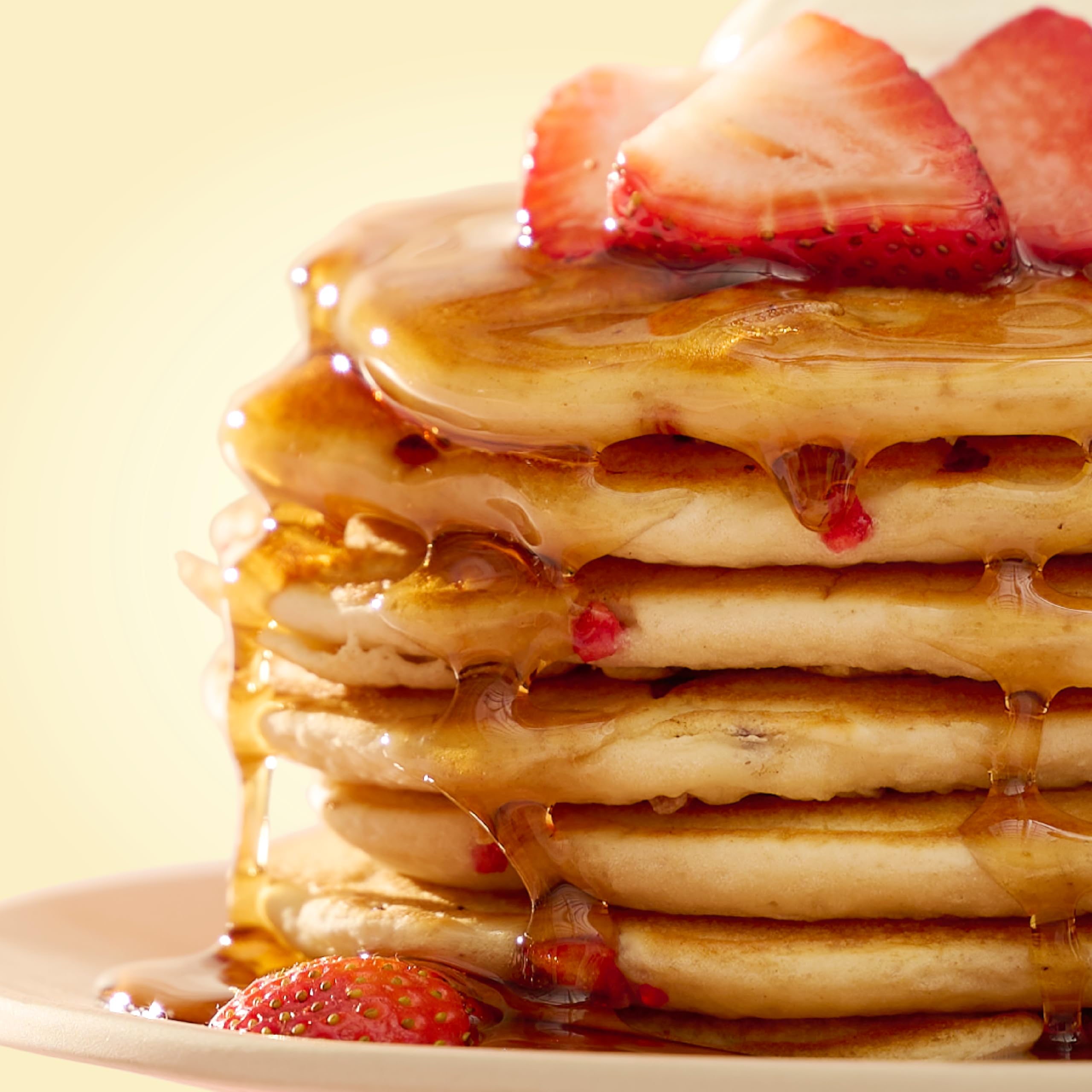 Fluffy pancakes on a plate made with Bob's Red Mill mix.