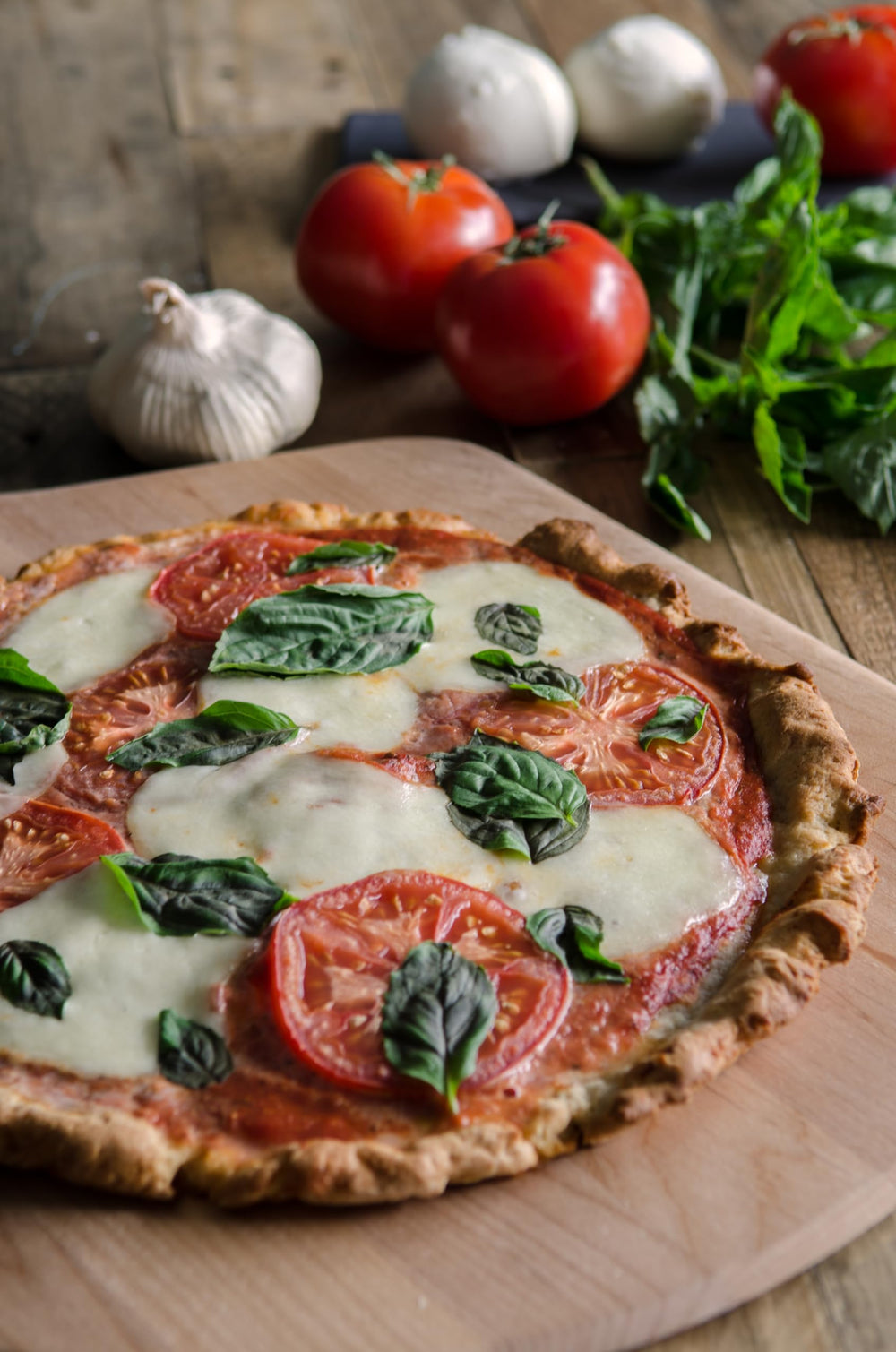 Served pizza slice showcasing two 12-inch crusts and toppings.