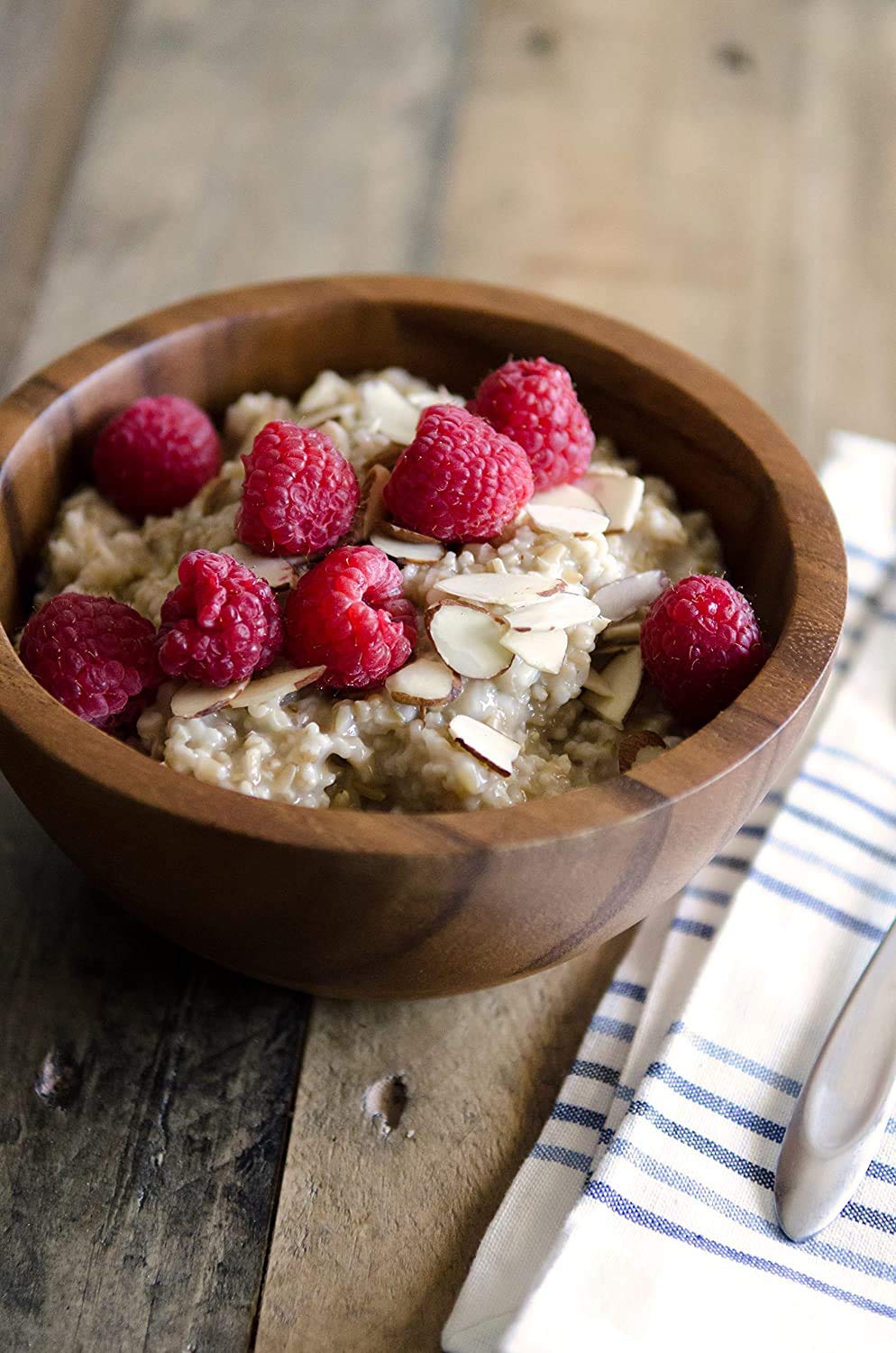 Bob's Red Mill oats served with yogurt and banana for balanced breakfast.