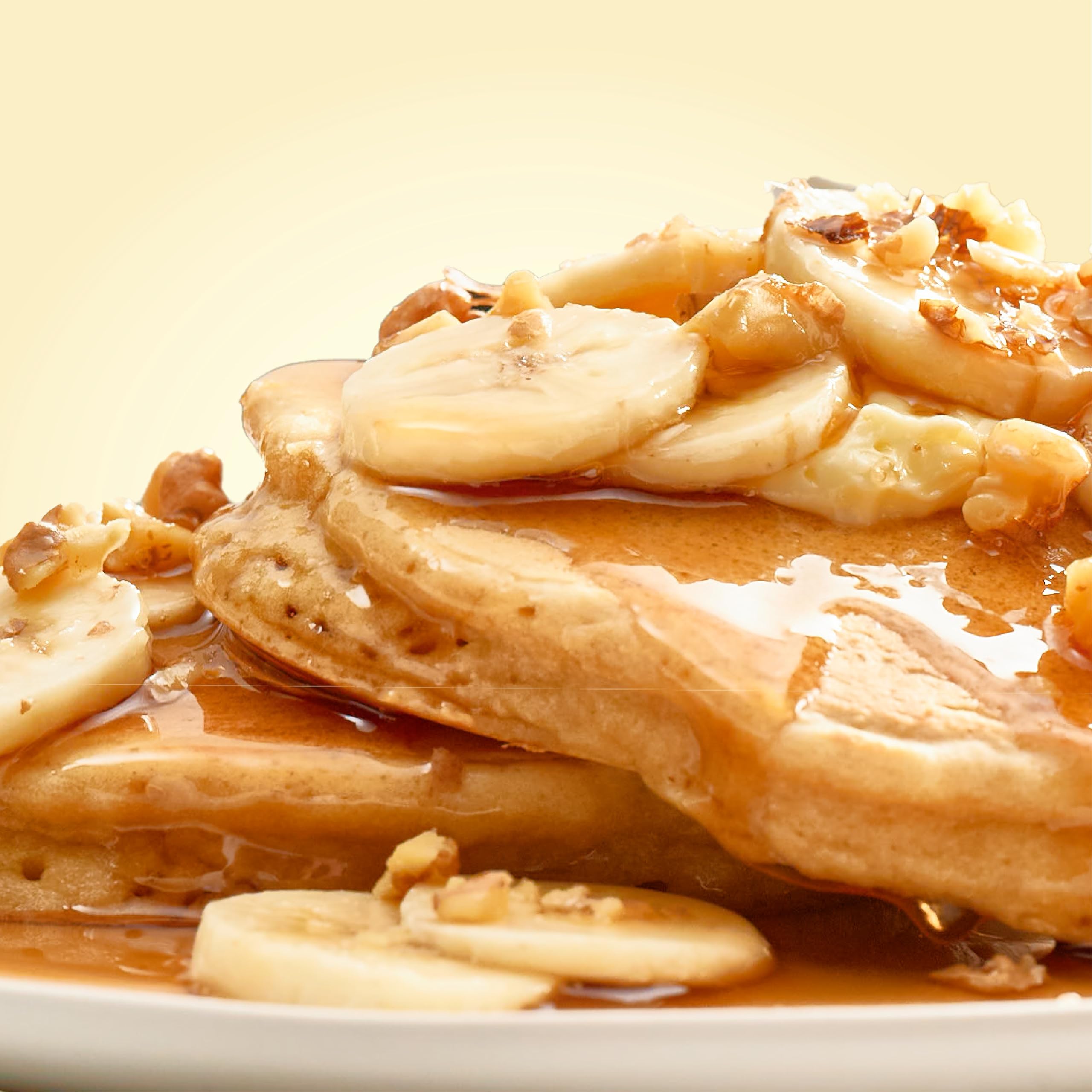 Waffles emerging from a waffle iron with a crisp exterior