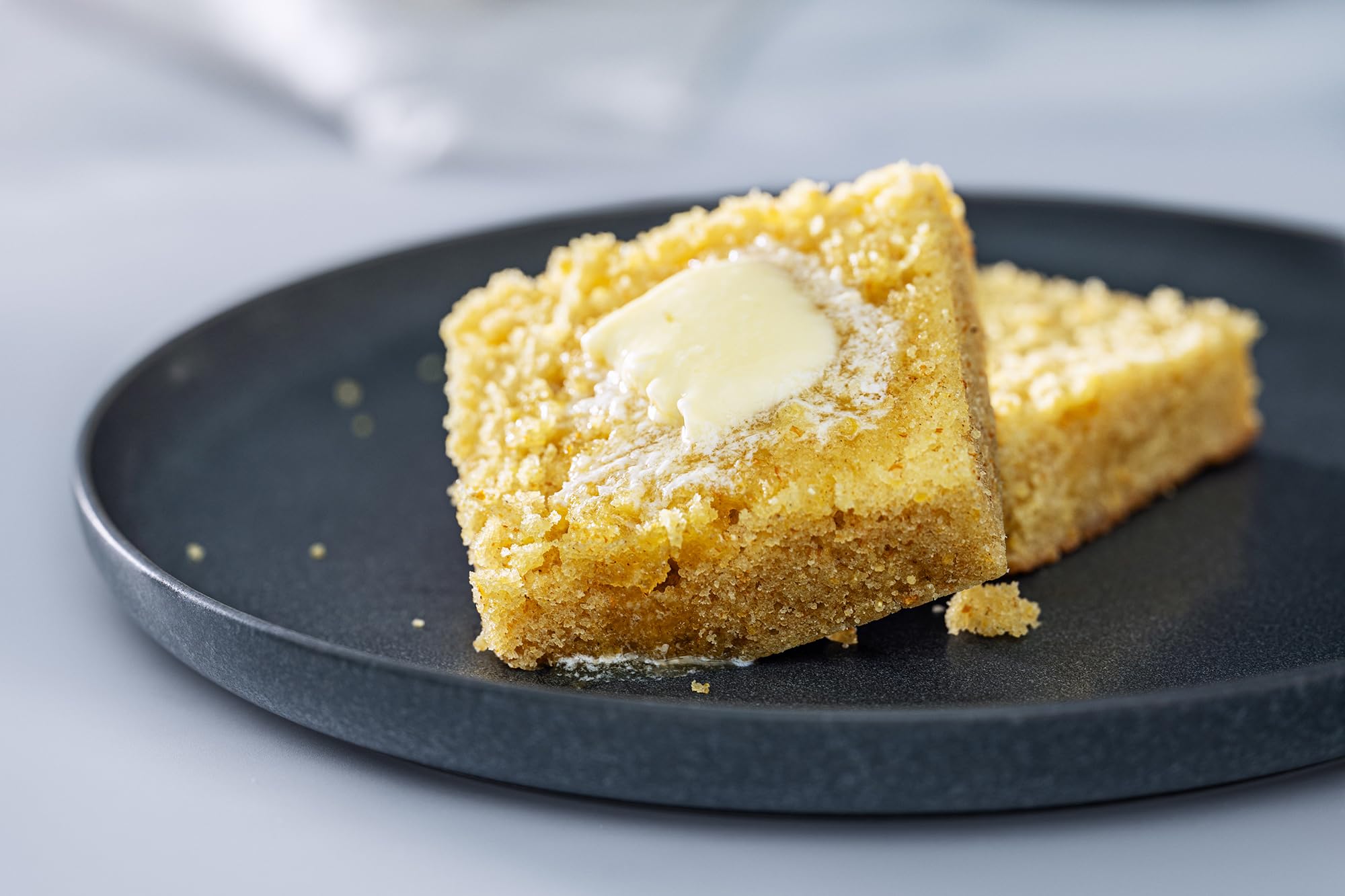 Bob's Red Mill sliced cornbread on a plate with warm aroma