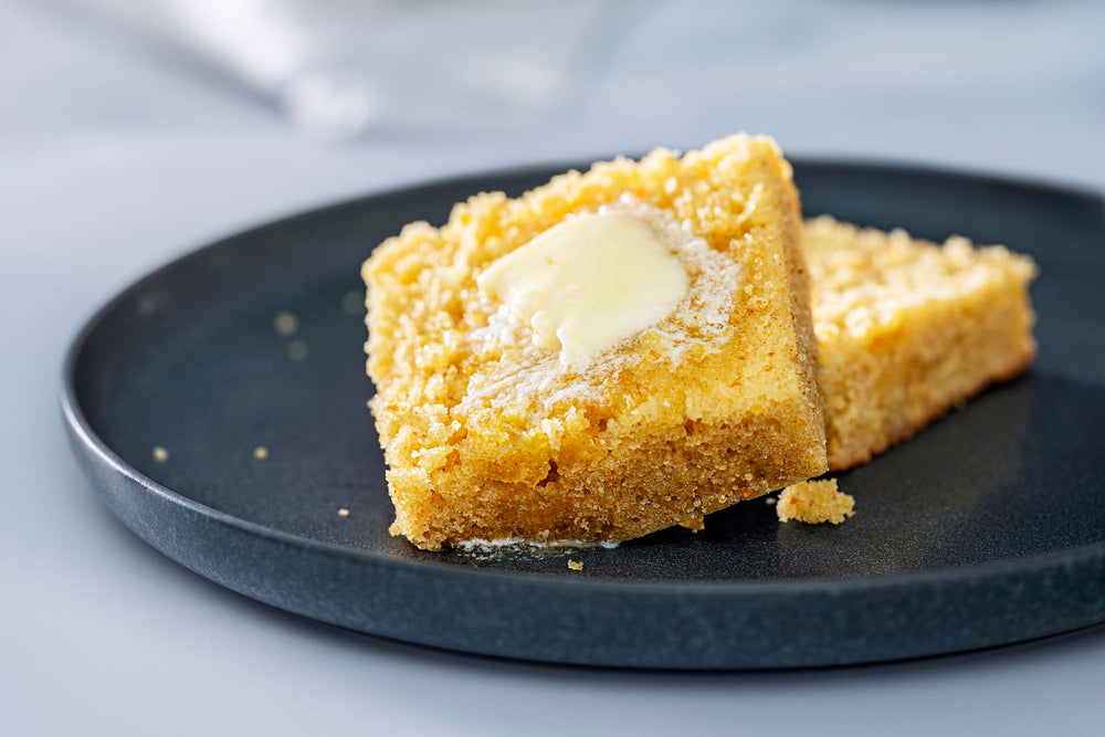 Bob's Red Mill sliced cornbread on a plate with warm aroma