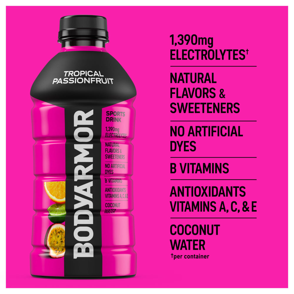 Athlete holding BODYARMOR Tropical Passionfruit during training