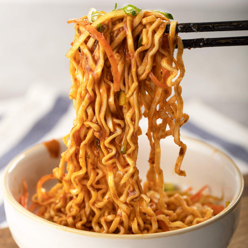 Close-up of finished Boiling Point Wok Noodles in a vibrant dish.