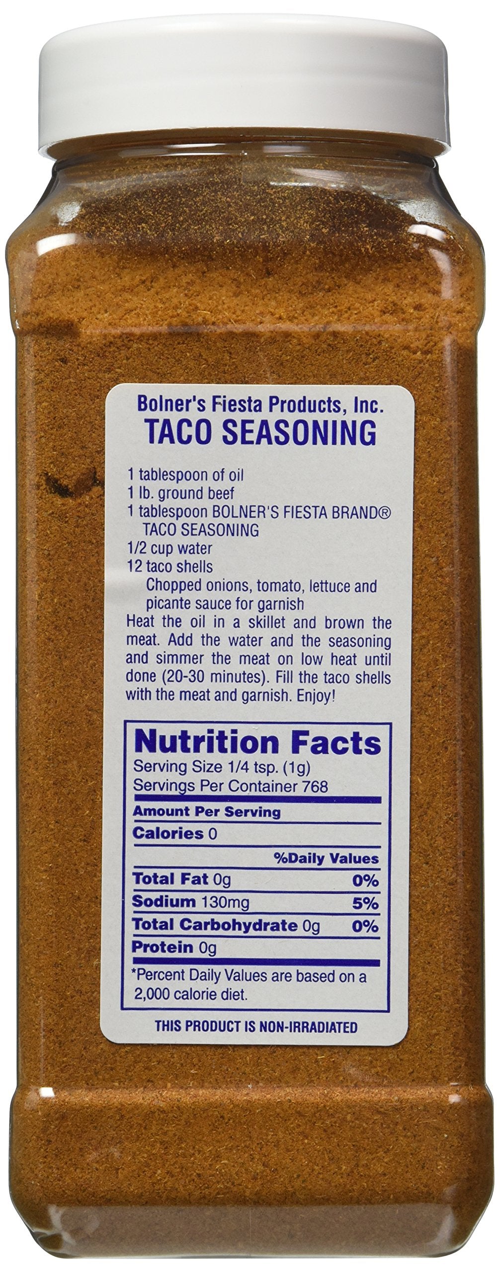 Bolner's Fiesta Taco Seasoning being scooped into ground beef for quick taco night.
