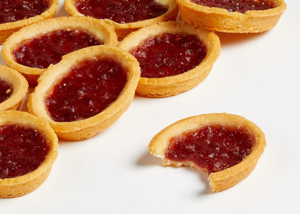 Close up of buttery shortbread crust in the tartlets