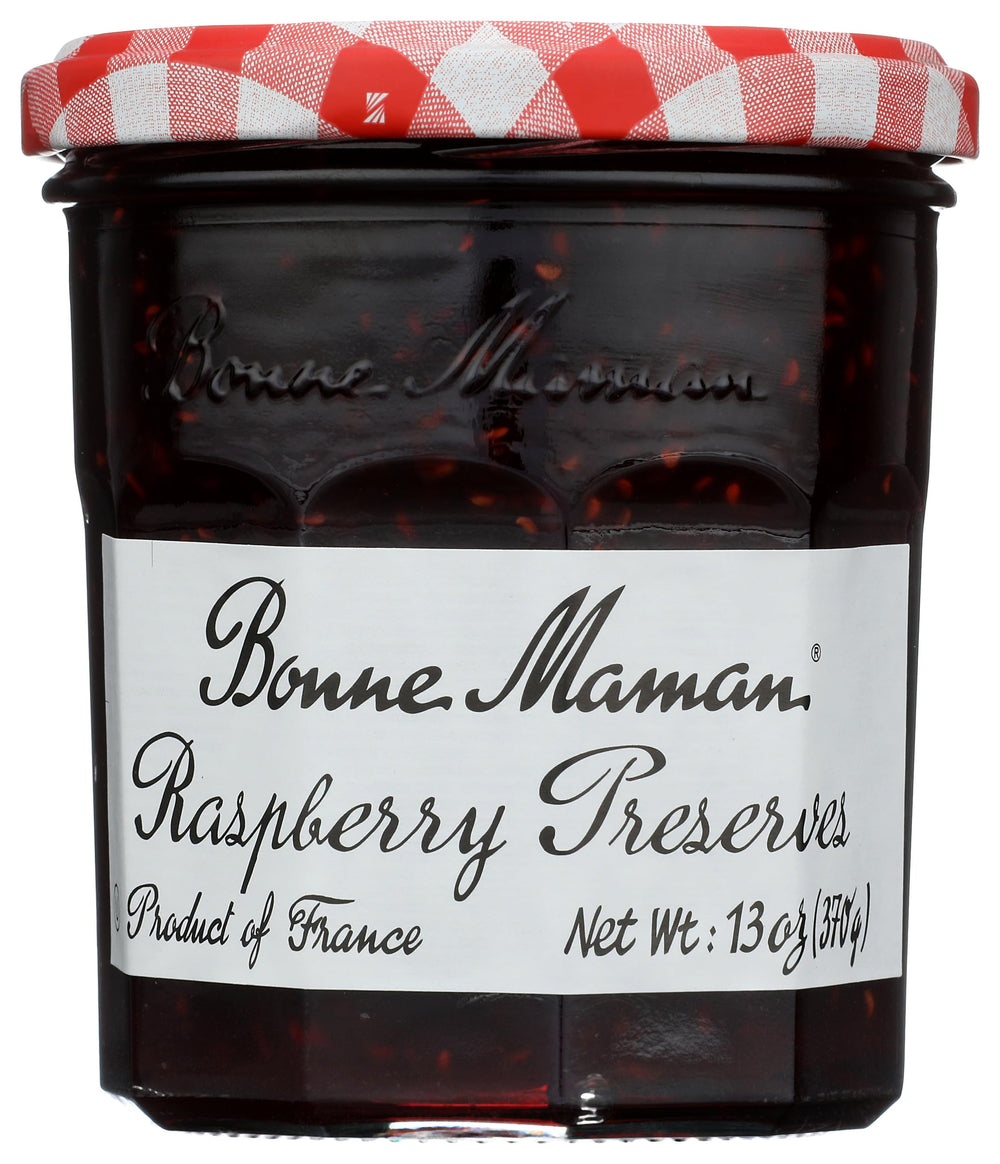 Bonne Maman Raspberry Preserves jar close-up highlighting rich fruit and glossy texture.