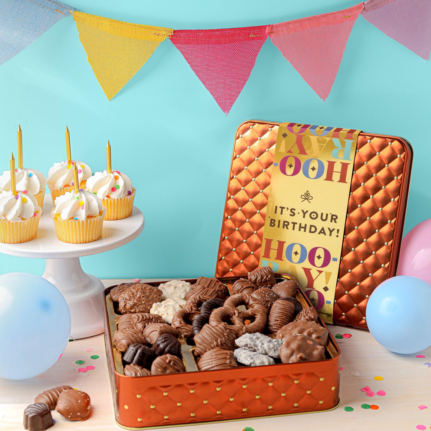 BONNIE AND POP Assorted chocolates collection showing milk, dark, and white varieties for celebrations.