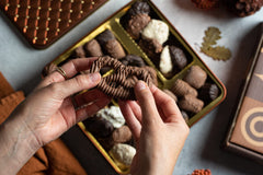 Close-up of Bonnie and Pop chocolates in a colorful variety display.