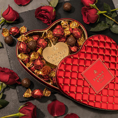 Bonnie & Pop red heart tin with gold dots elevates gift presentation.