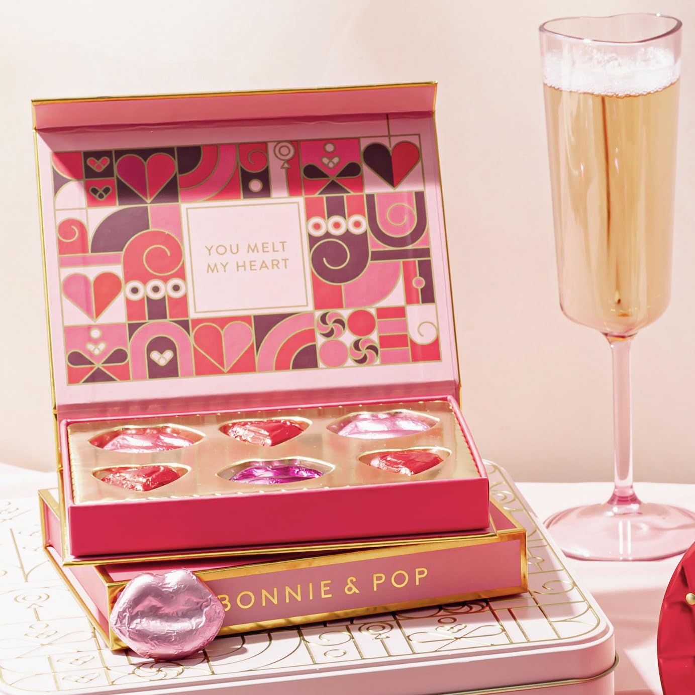 BONNIE AND POP romantic gift idea shown on a table with chocolates.