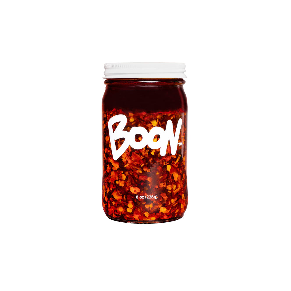 Boon Sauce Chili Oil bottle adds bold heat and umami to dishes.