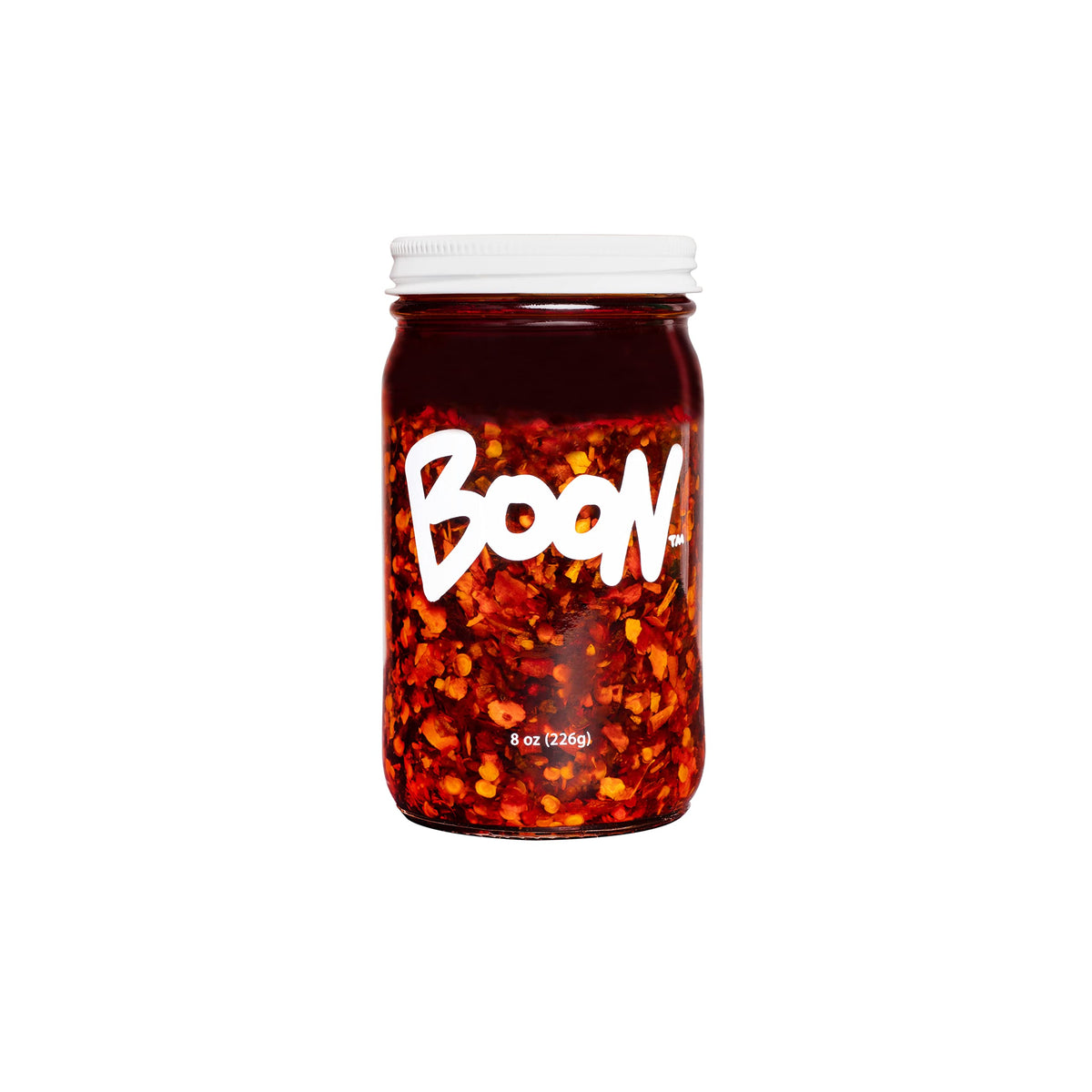 Boon Sauce Chili Oil bottle adds bold heat and umami to dishes.