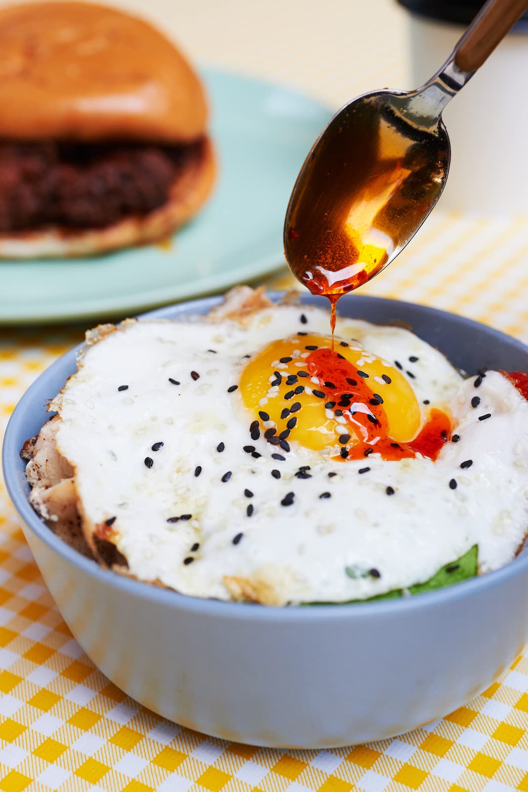 Boon Sauce Chili Oil drizzle over noodles showcases heat and aroma.