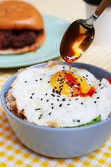 Boon Sauce Chili Oil drizzle over noodles showcases heat and aroma.