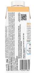 Close-up of BOOST Breeze orange nutritional drink being poured into a glass.