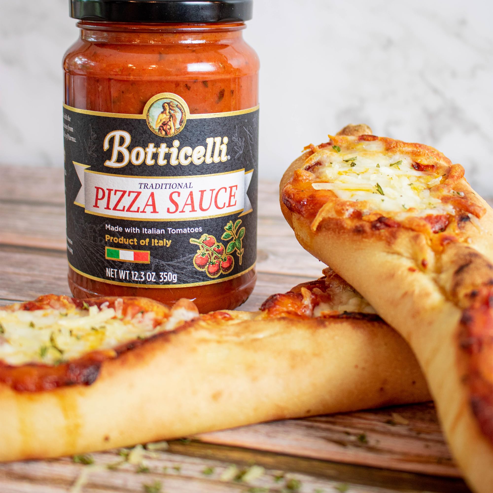 Botticelli sauce with garlic and oregano adds aromatic notes for homemade pizza.