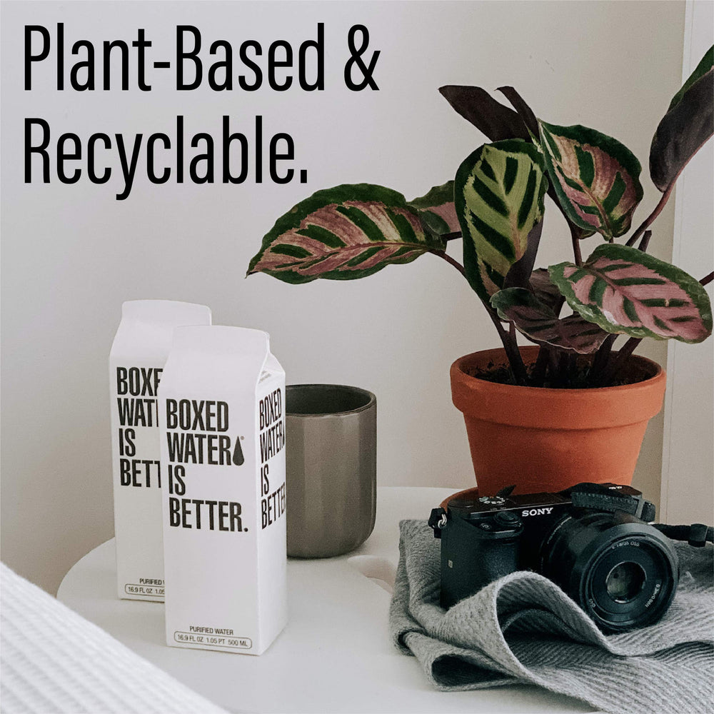 Boxed Water pouring into glass, crisp purified water on demand.