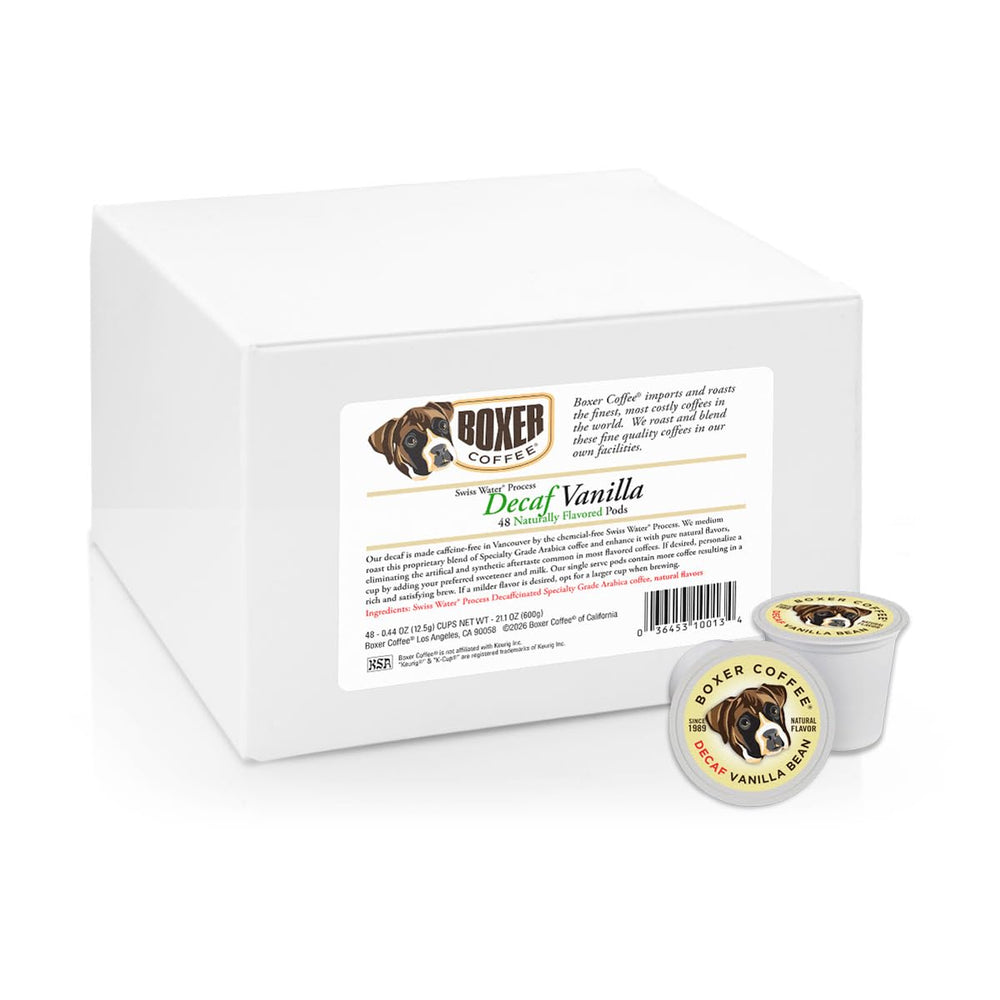 Boxer Coffee decaf pods held in hand showcase the 48 count eco box.
