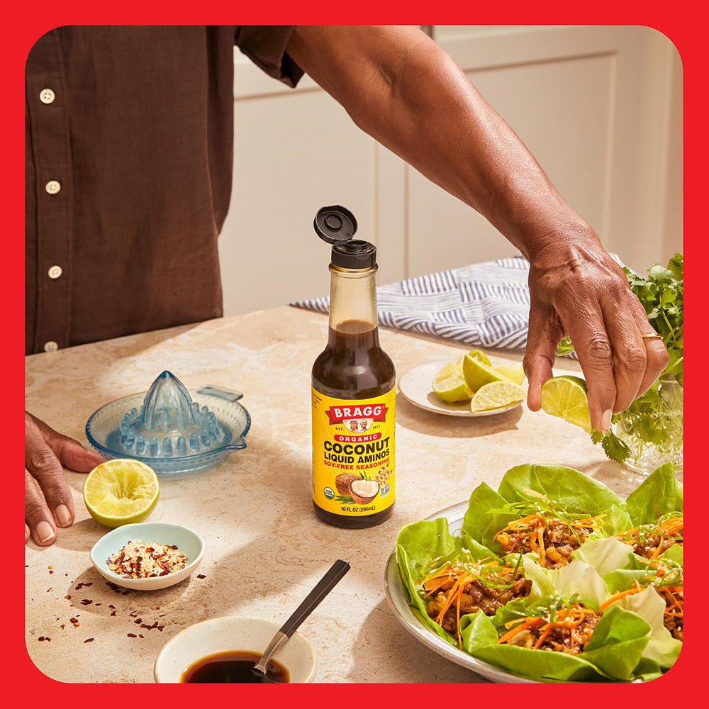 Rice bowl topped with Bragg Coconut Aminos for flavor enhancement.