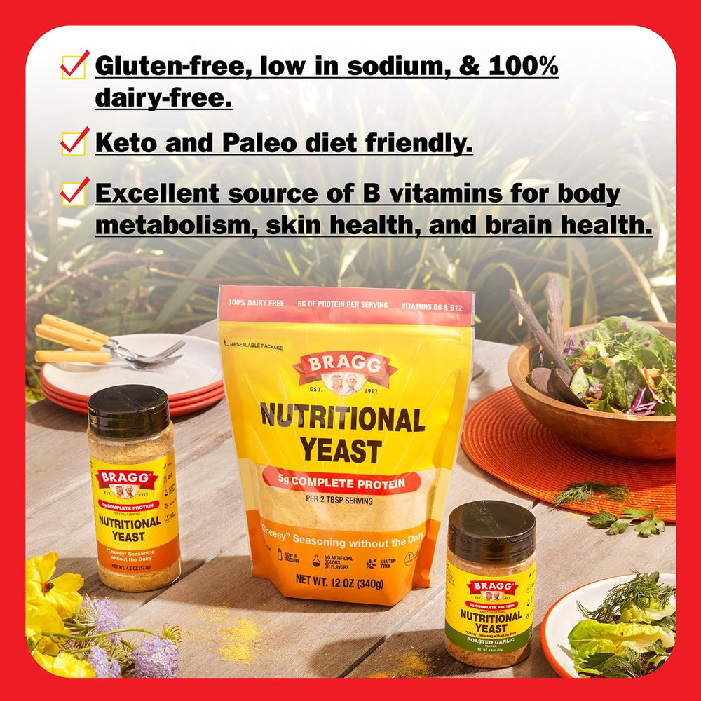 Bragg nutritional yeast sprinkled on salad bowl to boost protein and flavor.