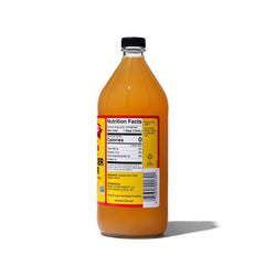 Bragg ACV bottle being poured to show versatile kitchen use.