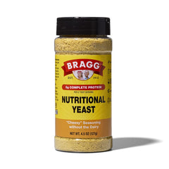 Bragg Premium Nutritional Yeast Seasoning bottle with shaker top; adds cheese-like flavor to salads.
