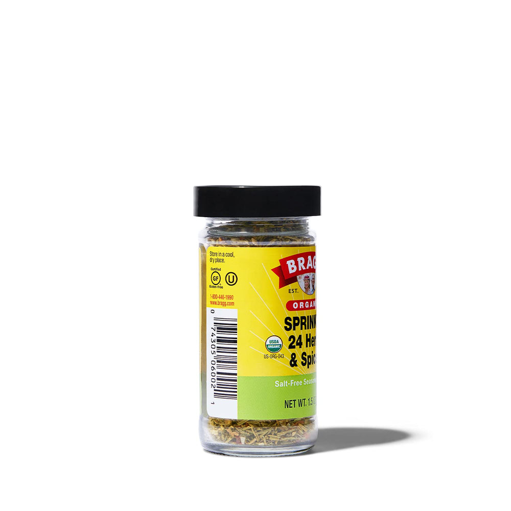 Bragg Sprinkle herb seasoning bottle pouring to enhance roasted vegetables.