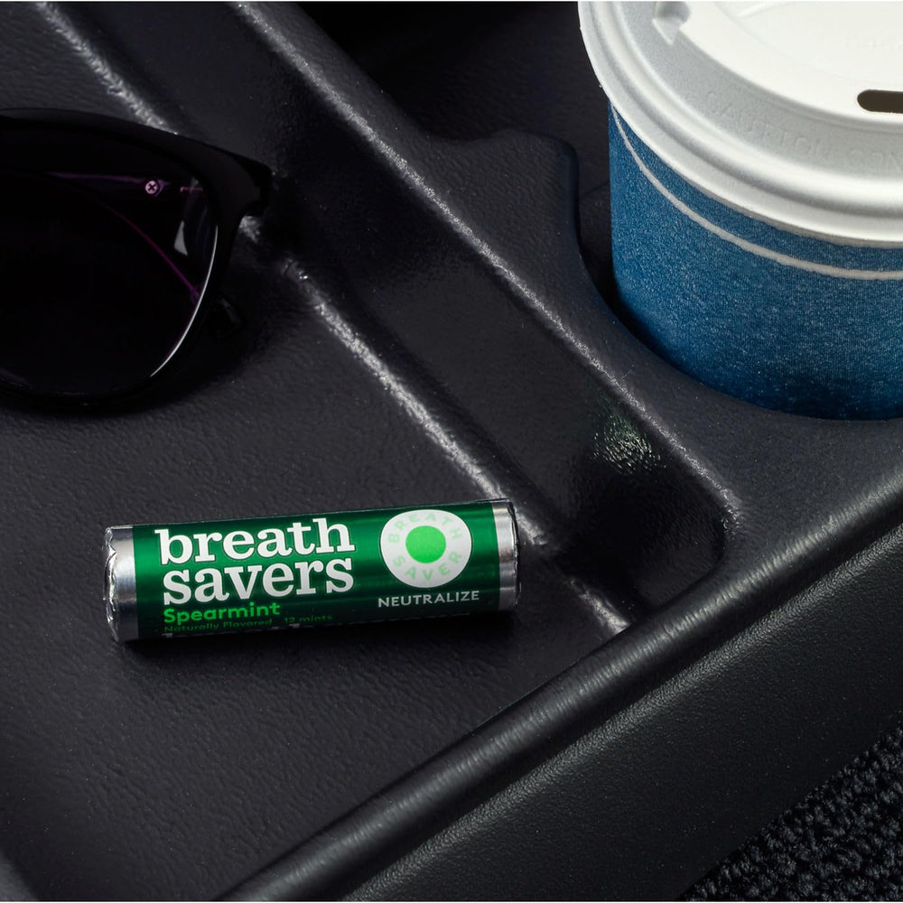 Breath Savers mint being popped into mouth for a quick breath boost.