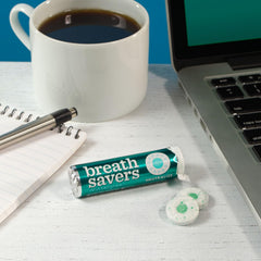 Breath Savers Wintergreen mints on a desk, a quick breath refresher.